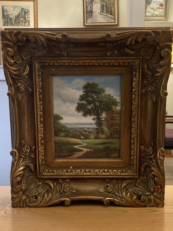 Framed oil painting in ornate frame