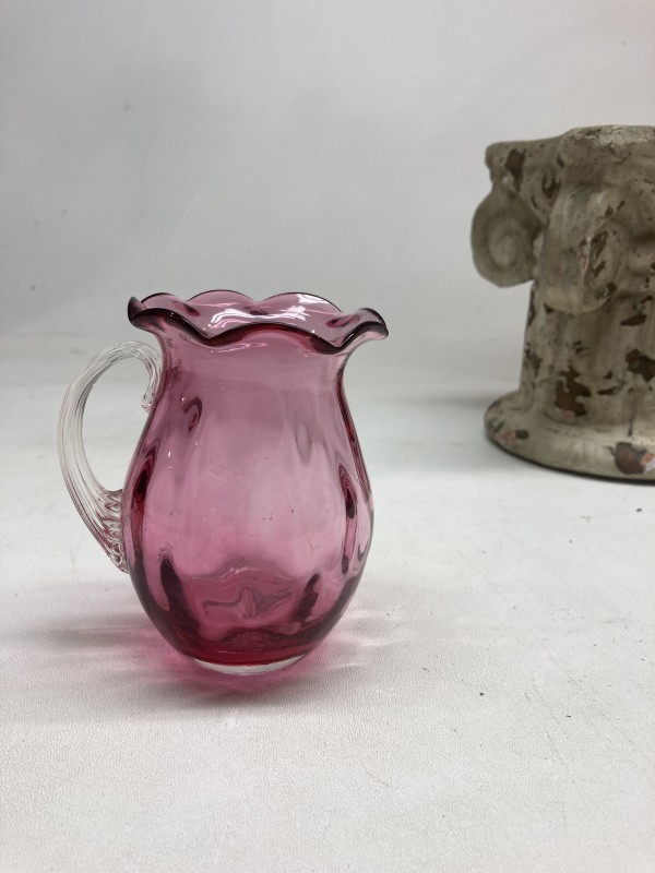 Small turn of the century cranberry glass creamer