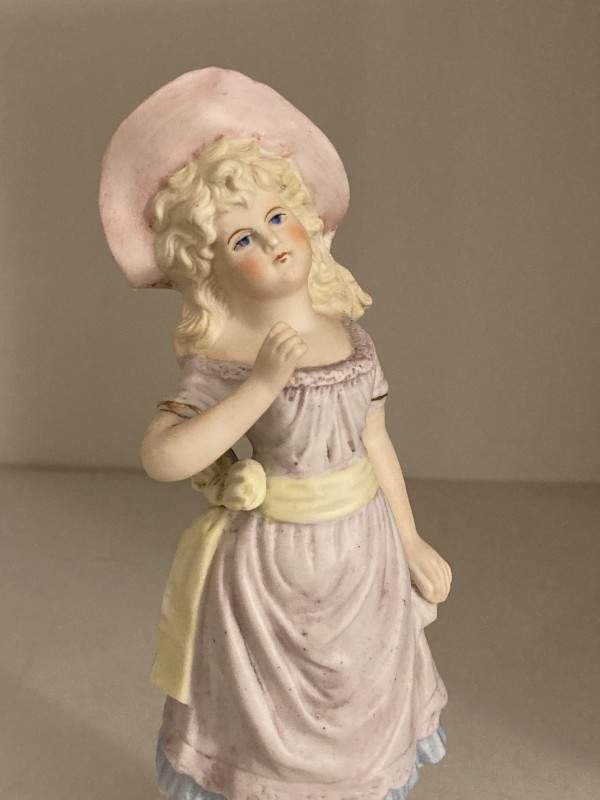 hand painted bisque figure with pink hat