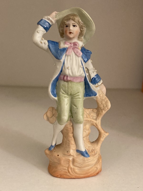 hand painted porcelain boy with blue coat