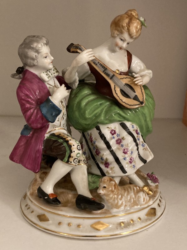hand painted porcelain group with man and woman musicians