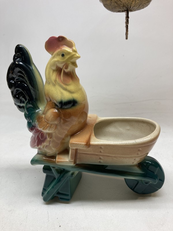 pottery rooster with wheel barrow