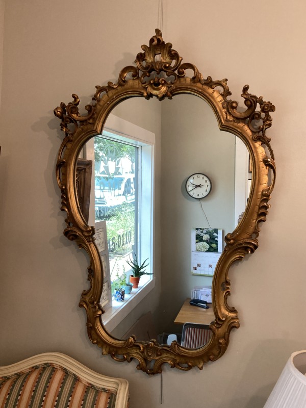 Carved ornate gold mirror