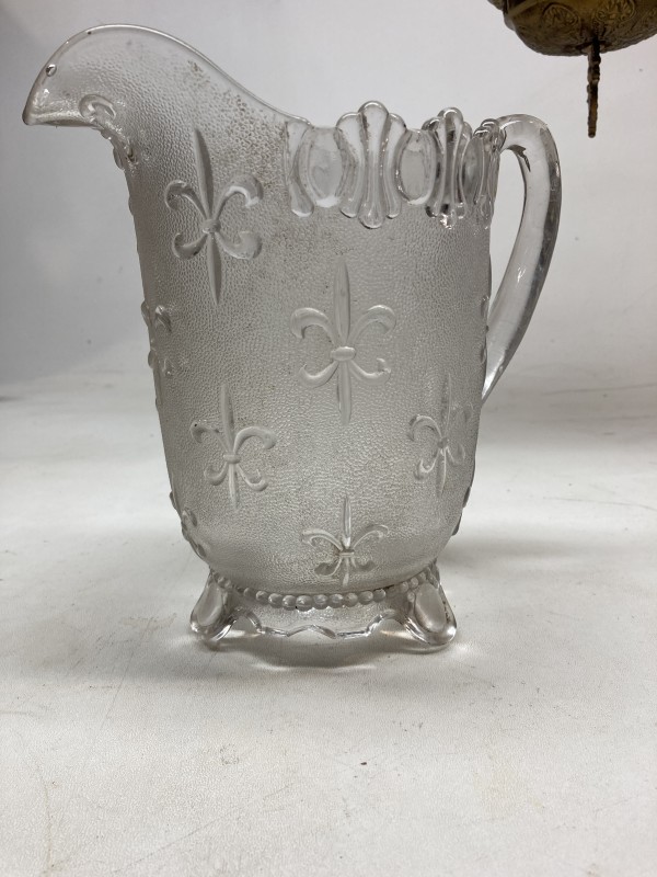 EAPG clear glass pitcher with Fleur De Lis pattern