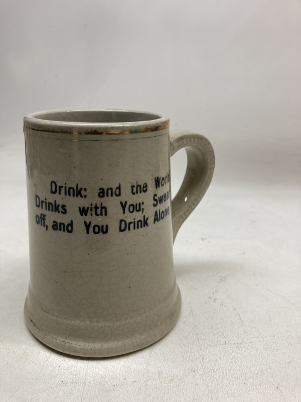 pottery mug with drinking motto