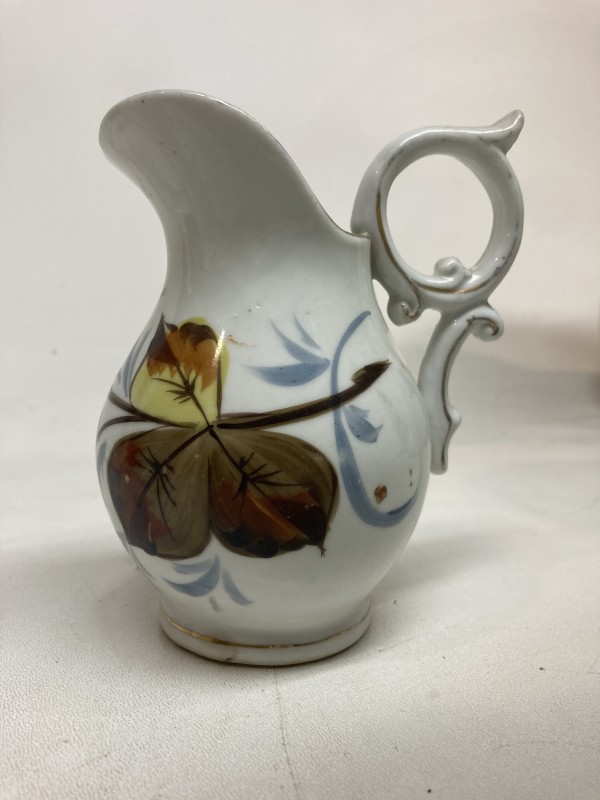 small porcelain pitcher with hand decorated fruit