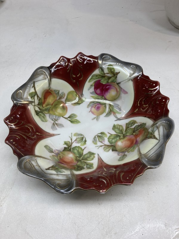 Hand decorated serving plate with red and white background with fruit decoration