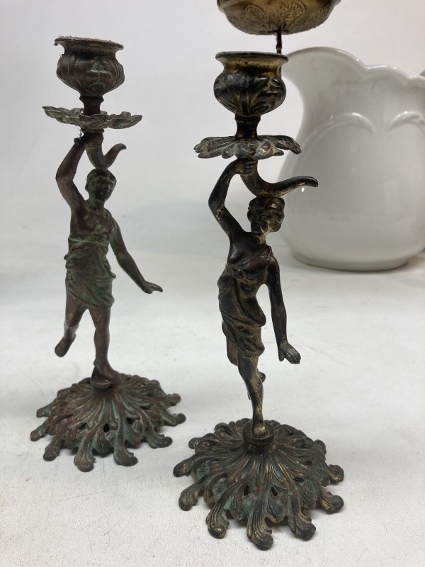 Pair of metal figurative candle sticks