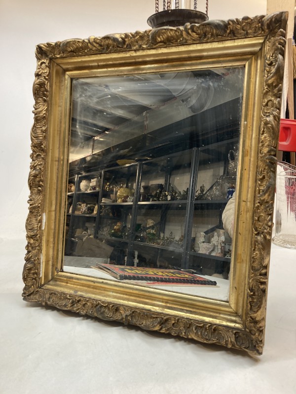 Framed ornate gold mirror