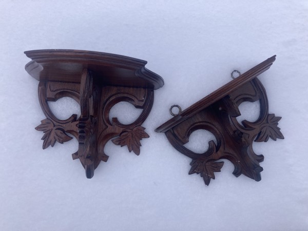 pair of Victorian walnut Black Forest wall shelves