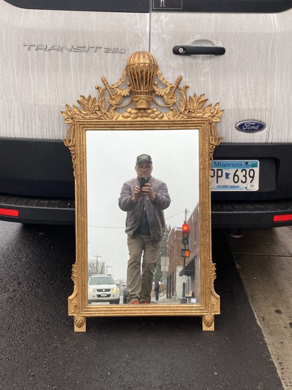 Carved gold gilt mirror with ornate frame with balloon