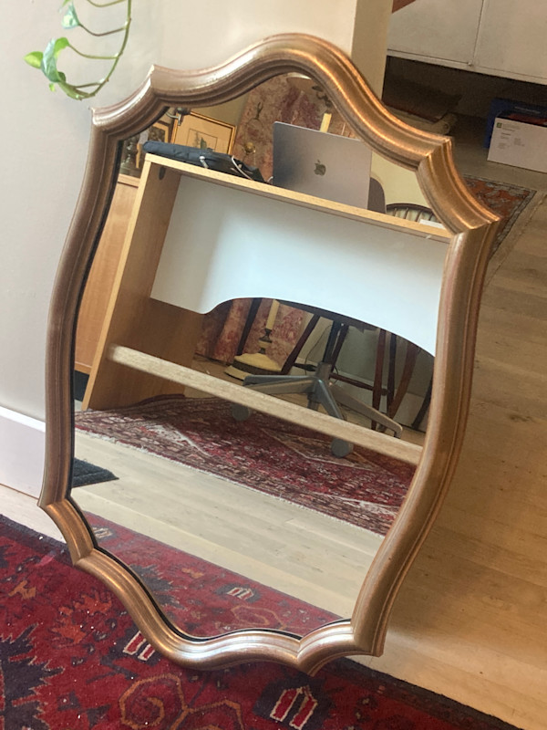 Framed shapely mirror