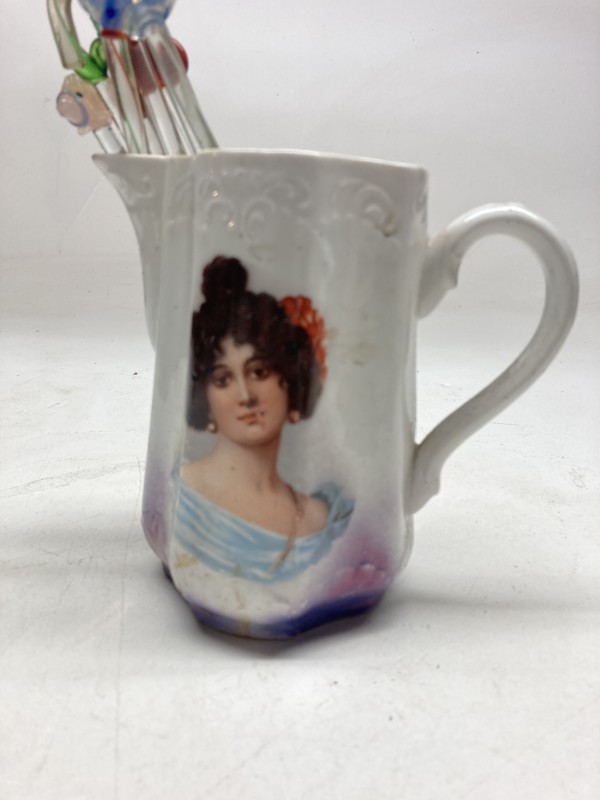 Victorian porcelain pitcher with woman face