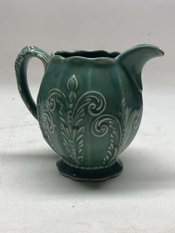 decorated pottery blue green pitcher