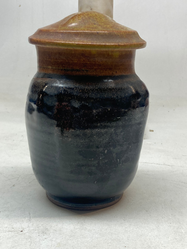 hand made covered pottery vase