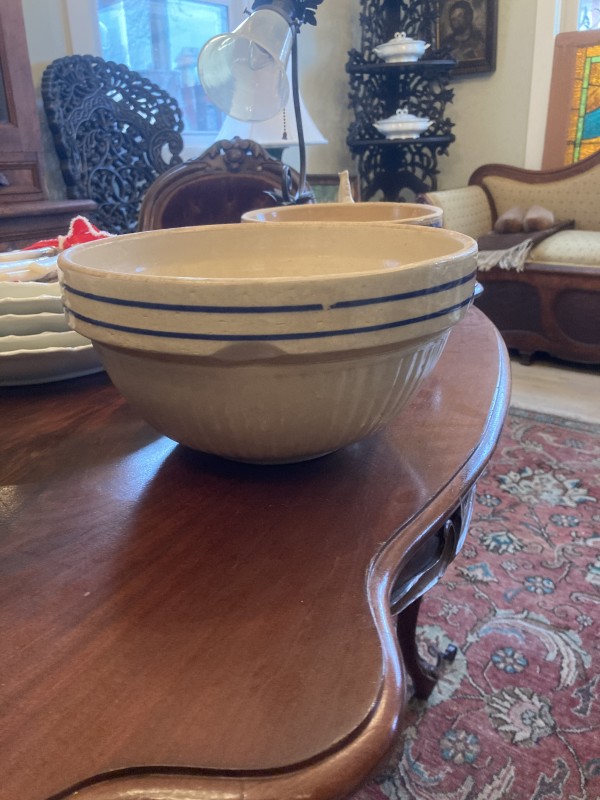 large vintage pottery mixing bowl with blue stripes