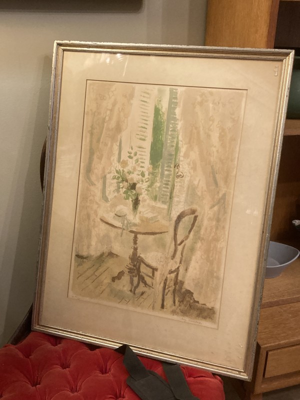 Framed signed print with chair and table