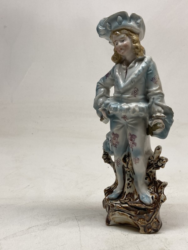 Soft paste German porcelain figure of boy in hat