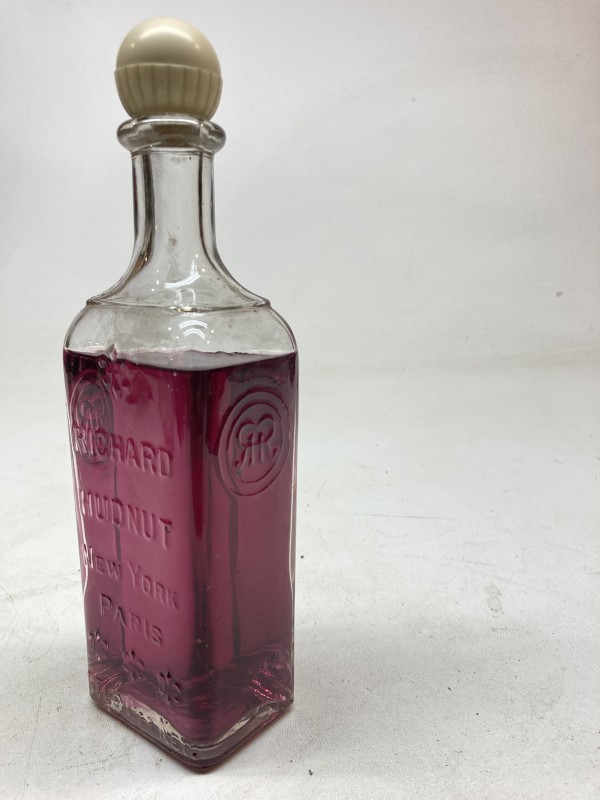 embossed vintage glass advertising lidded bottle