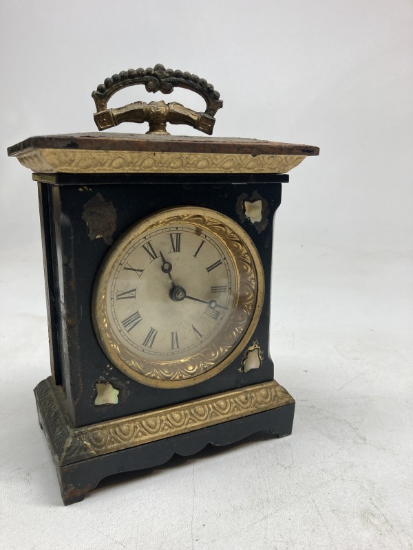 small cast iron turn of the century clock