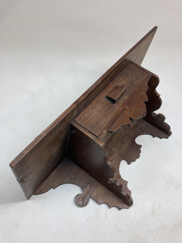 carved turn of the century shelf with drawer