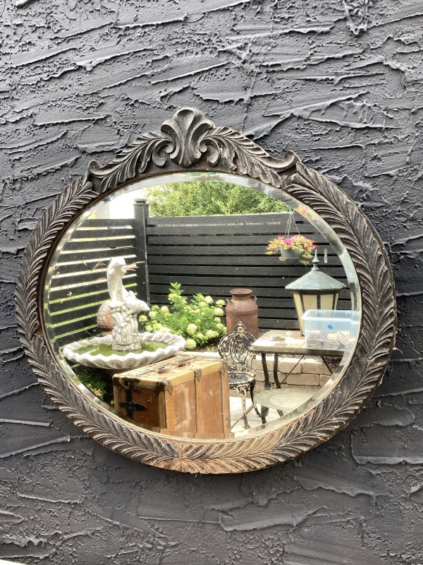 black painted oval mirror