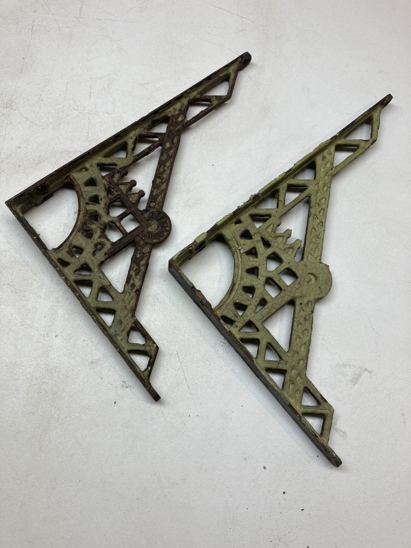 pair of painted iron brackets