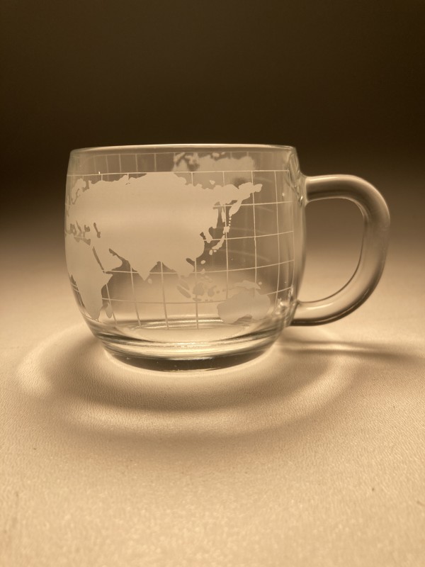 Set of clear creamer and covered sugar with world motif