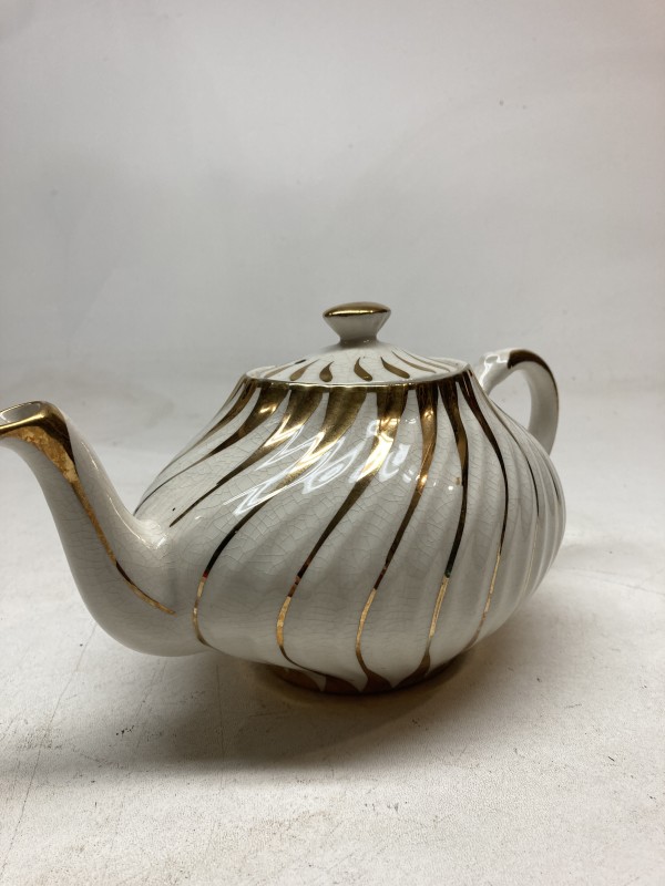 white and gold Hall teapot