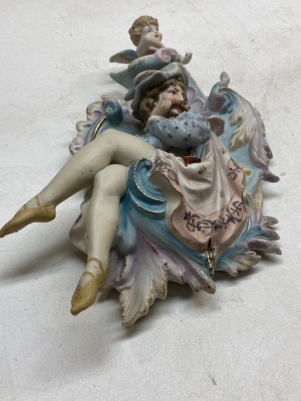 hand painted ornate porcelain figural plaque with cherub