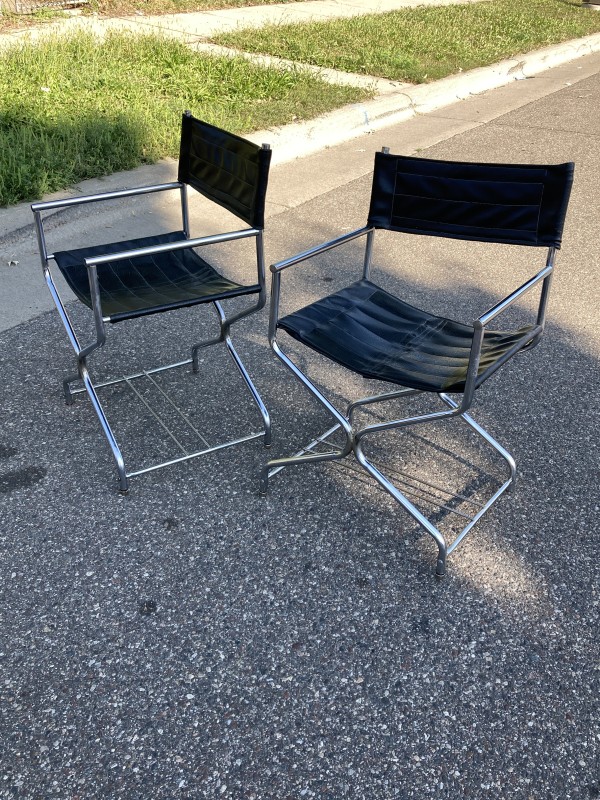 pair of chrome black directors chairs
