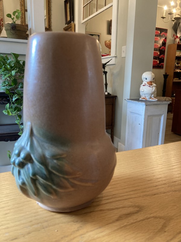 art pottery vase with green flowers