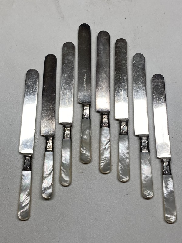 Set of 8 pearl handled turn of the century knives