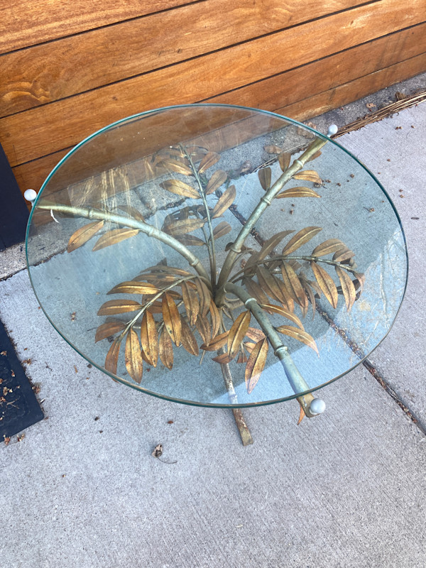 glass top table with leaf base
