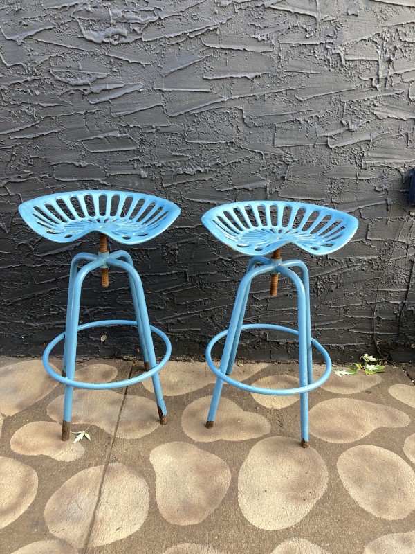 Pair of blue outdoor tractor seat stools
