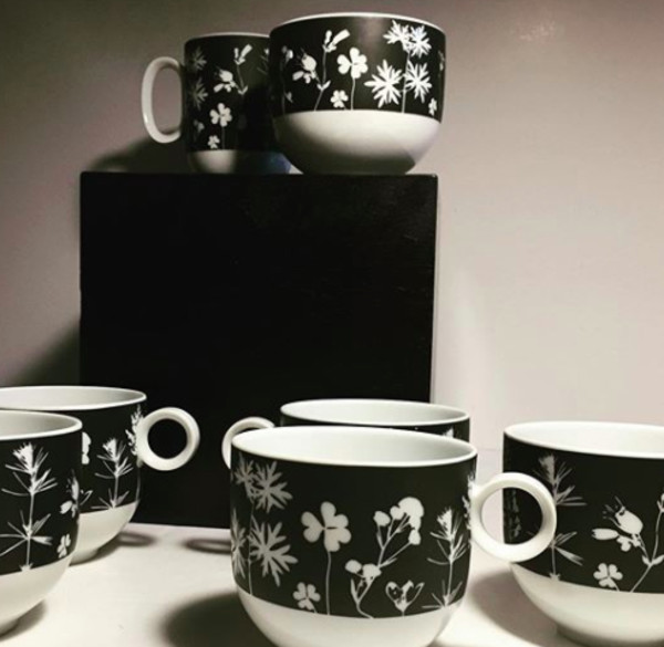Set of black and white cups and saucers