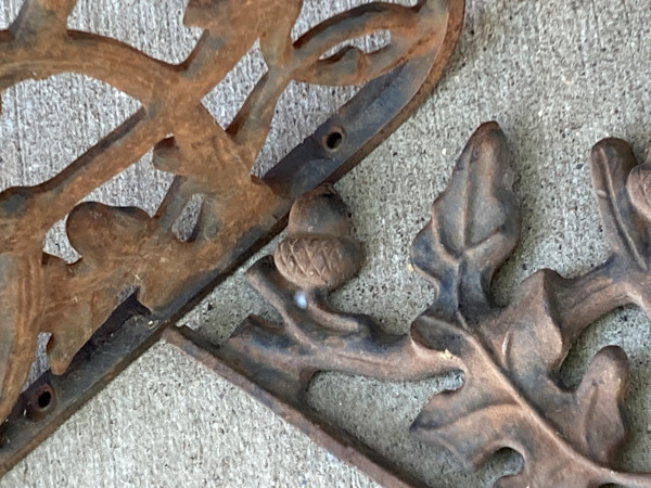 Turn of the century cast iron oak leaf brackets