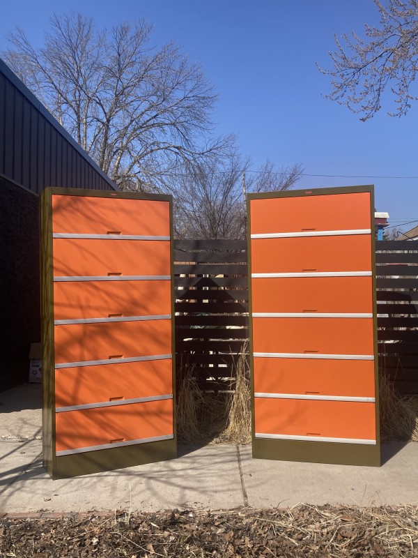 large orange and green metal filing cabinet