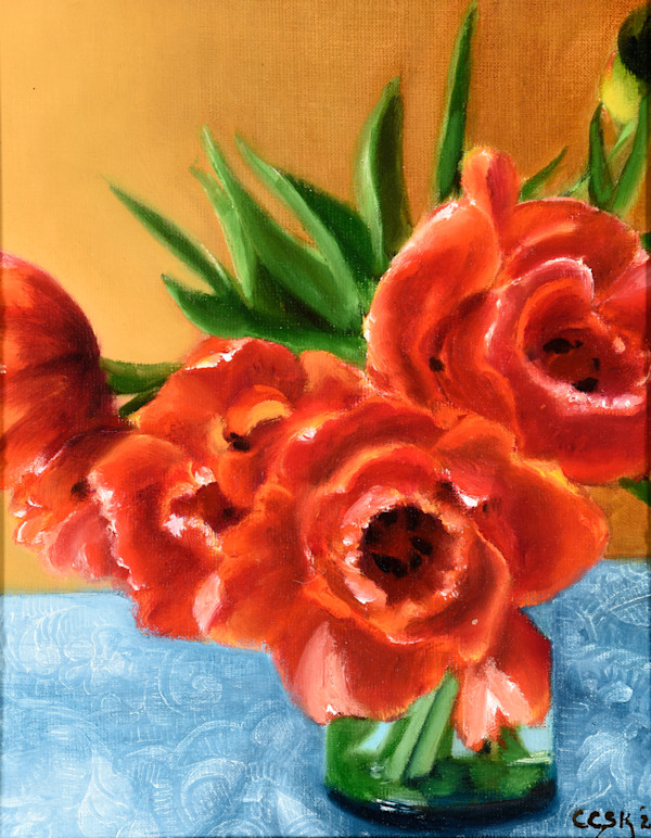 Orange and Red Flowers on a Lace Tablecloth by Carolyn Kleinberger