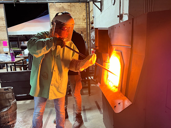 Artist Susan Madacsi ladling glass for sand casting. by Susan Madacsi, Image 8.