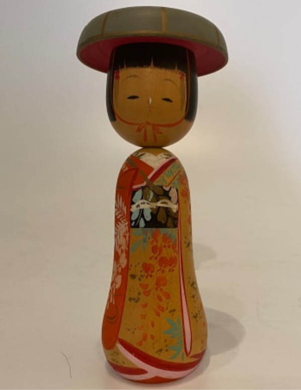 Kokeshi doll with hat