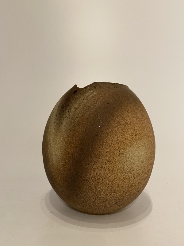 Brown ikebana vase with v-shaped design