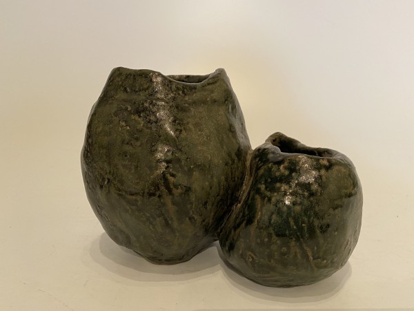 Two small connected ikebana vases