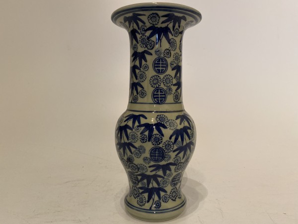 Ikebana vase with bamboo and flowers