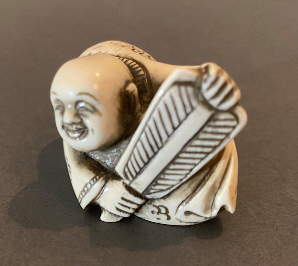 Netsuke - Hotei with fan