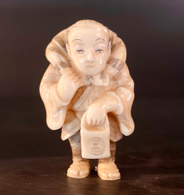 Netsuke - Standing man with lantern