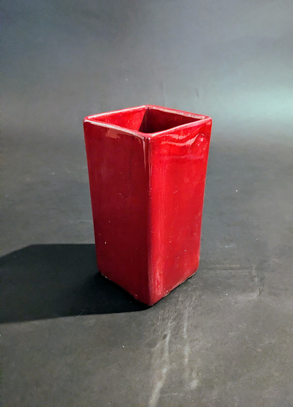 Small red ceramic ikebana vase