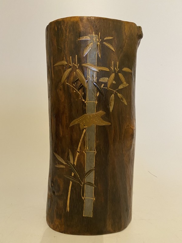 Wooden ikebana vase with bamboo and bird
