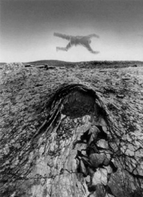Untitled (Floating body over rock) by Jerry Uelsmann