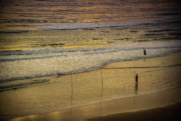 Fishermen at Sunrise - Daytona Beach, Florida by Jenny Nordstrom